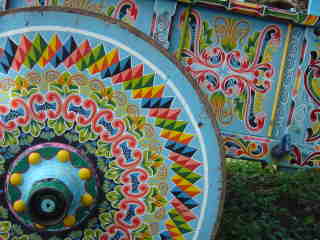 Blue ox cart with decorative painted wheel at ox cart parade in Escazu, Costa Rica